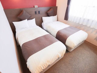 写真:全室シモンズ®製ベッドを導入